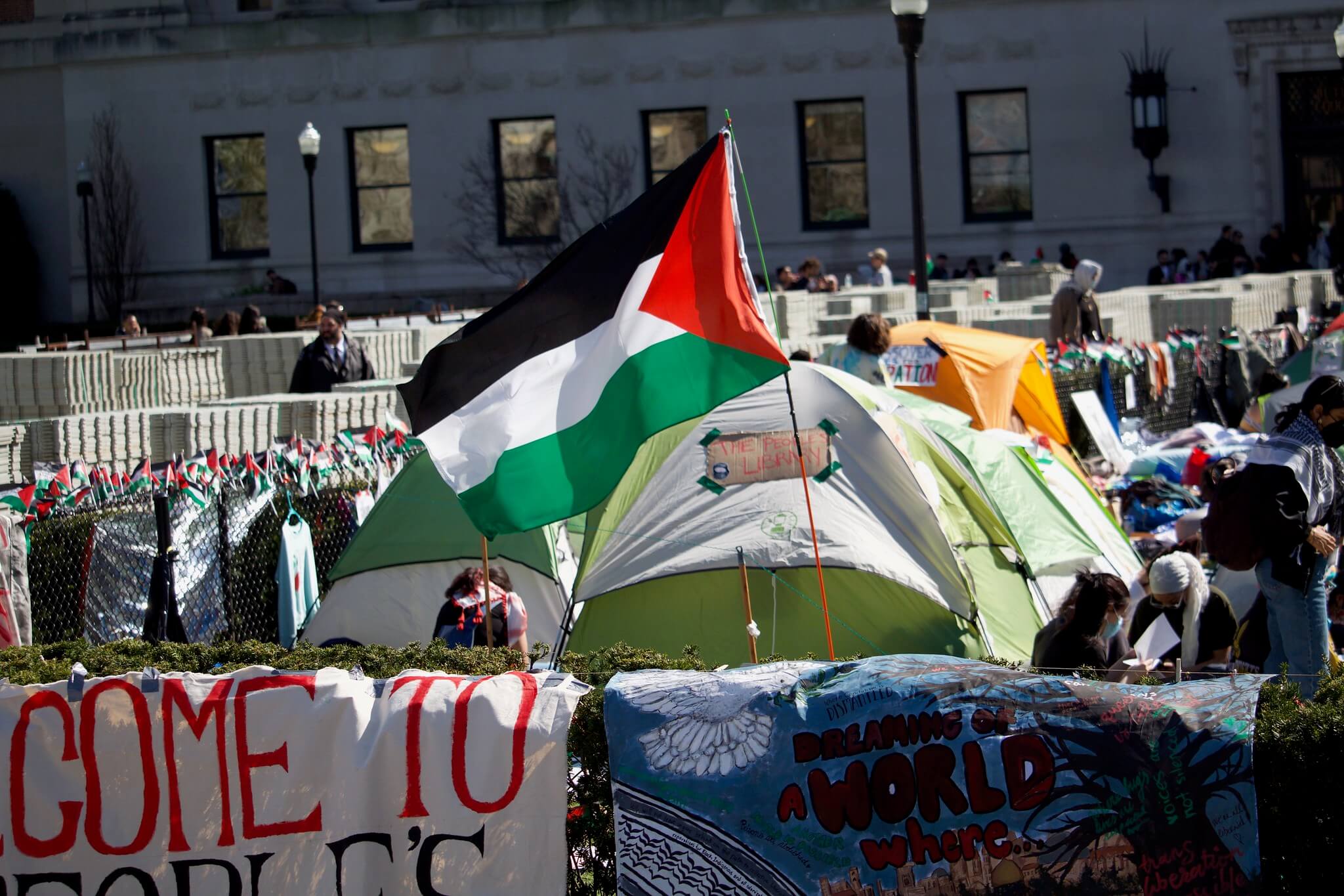 Image of a flag flying in the Columbia pro-Palestine encampment the day after an NYPD raid.