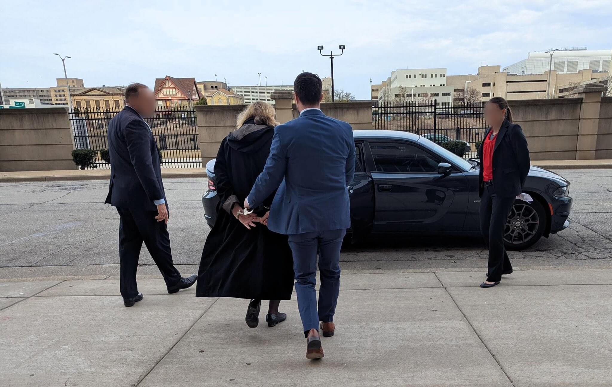 https://lawfare-assets-new.azureedge.net/assets/images/default-source/article-images/fbi_agents_arresting_wisconsin_circuit_court_judge_hannah_dugan_in_april_2025-%281%29.jpg?sfvrsn=d0f071b6_5