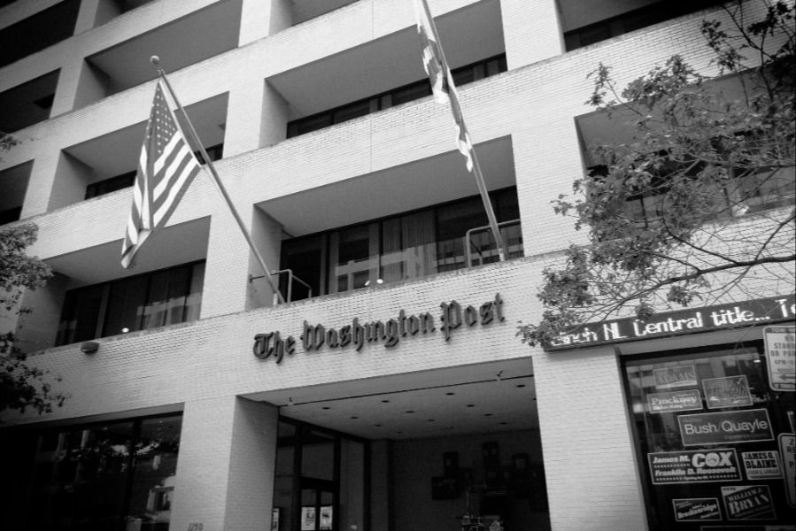 Black and white image showing the exterior of the Washington Post building